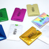 A collection of various colored and metallic RFID protection card sleeves displayed on a white background.