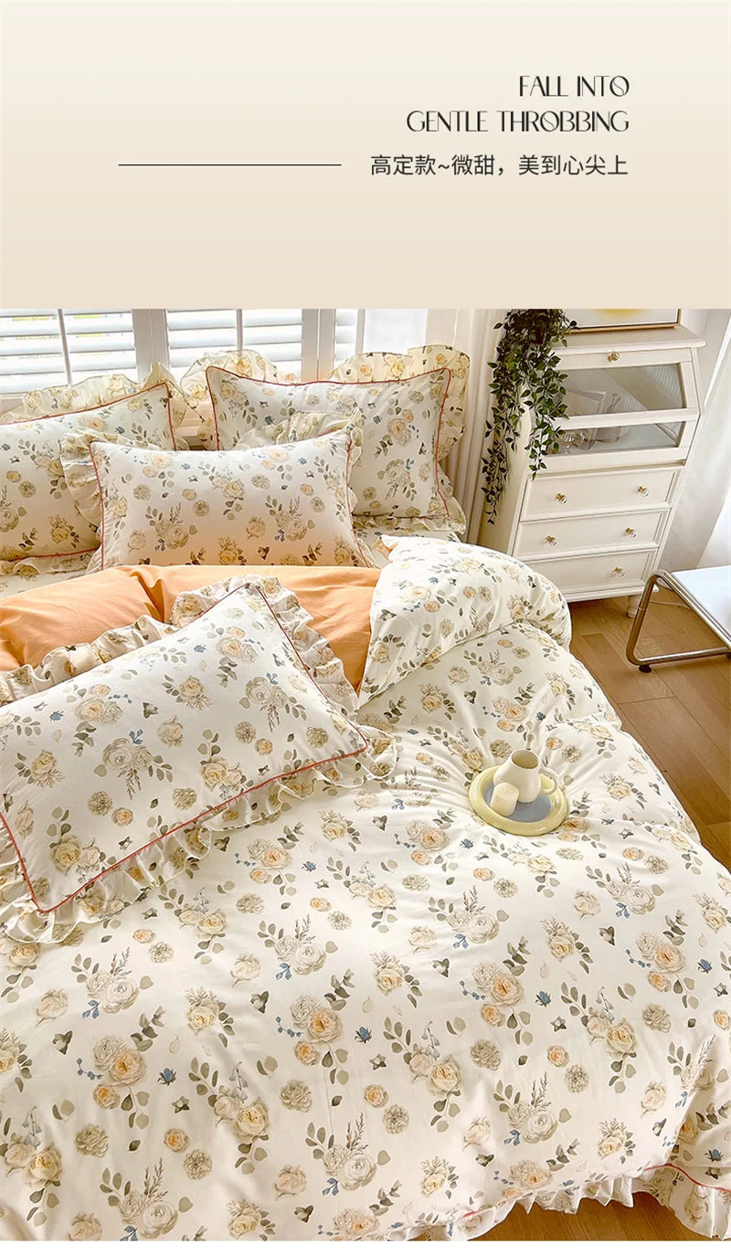 A floral duvet cover set featuring light beige and cream tones with ruffled edges, displayed on a bed.