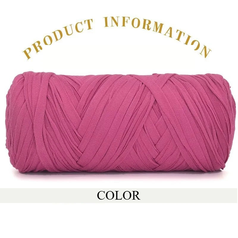 A skein of bright pink thick polyester blend yarn coiled for knitting and crochet.