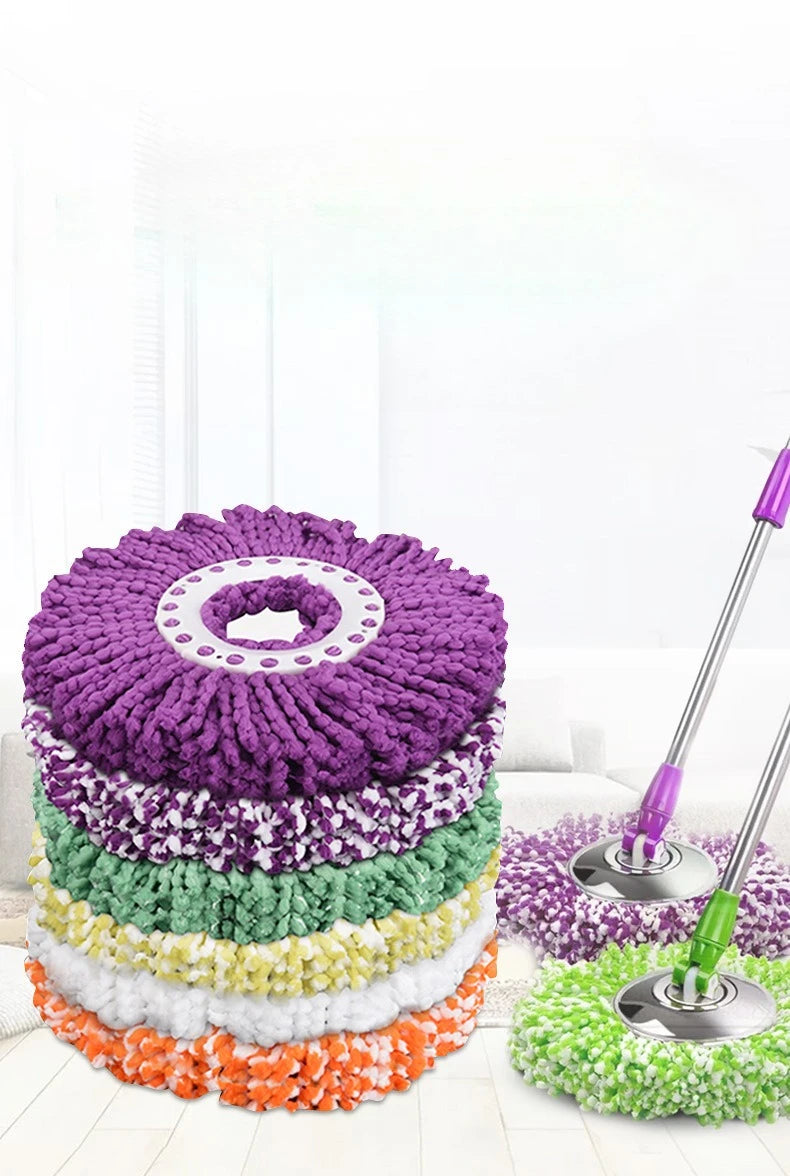 A set of two purple and green microfiber spinning mop heads for cleaning.