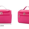 A bright pink hanging makeup bag with a zippered compartment and carrying strap.