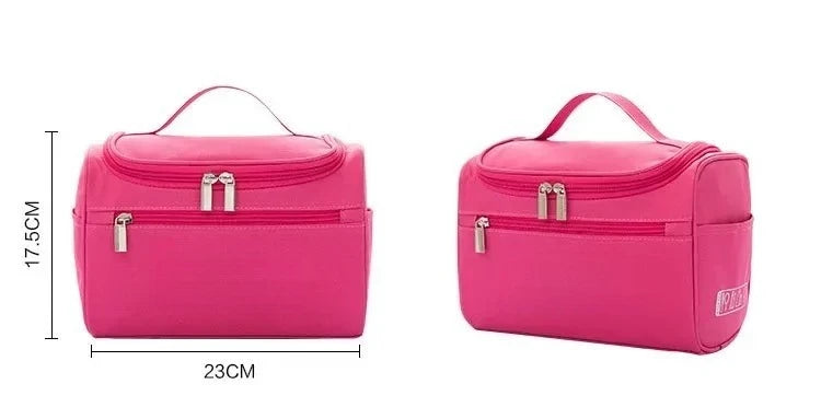 A bright pink hanging makeup bag with a zippered compartment and carrying strap.
