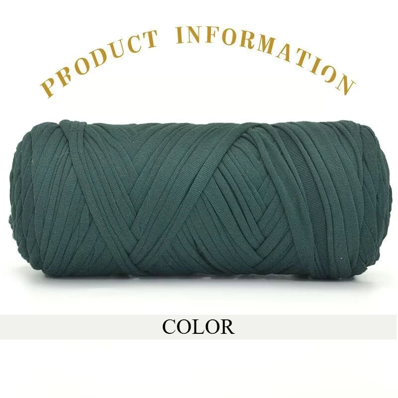 A skein of dark teal thick polyester blend yarn coiled for knitting and crochet.