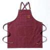 A deep maroon cotton canvas apron with cross-back straps and multiple patch pockets.