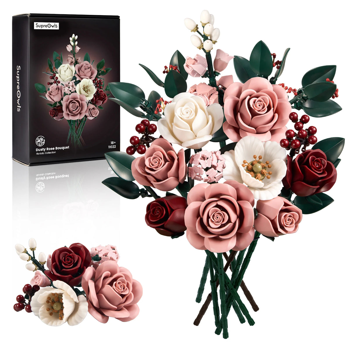 A bouquet of pink and cream roses and greenery displayed next to its packaging box.