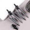 A set of eight drafting tools including compasses and rulers displayed on a white surface.