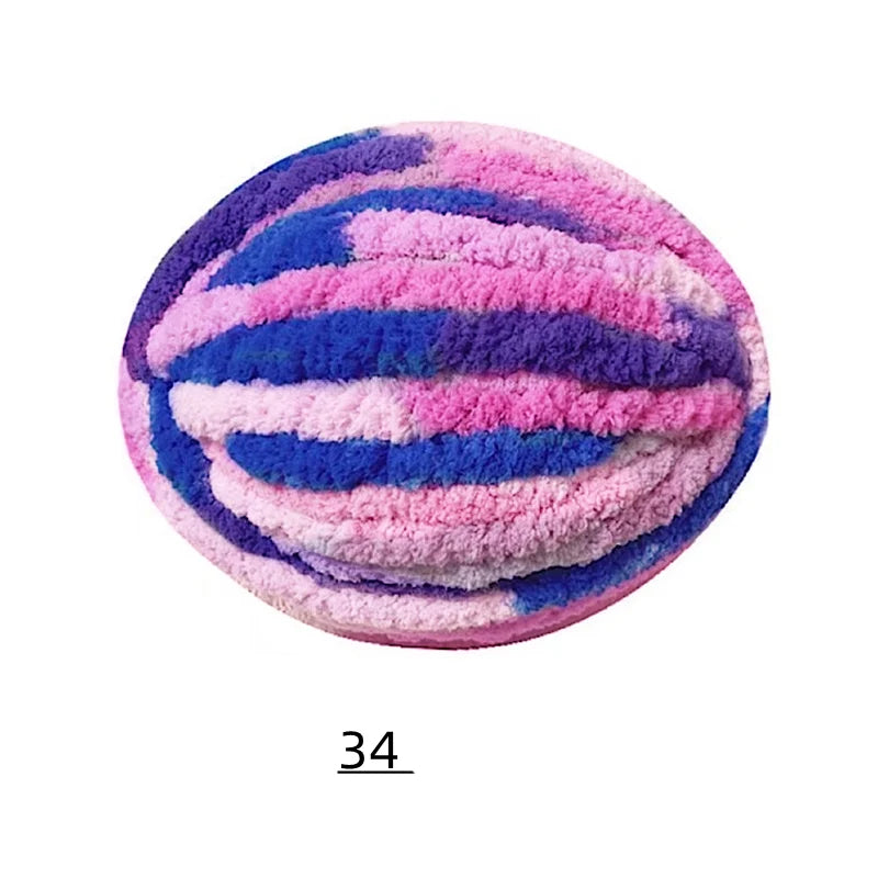 A ball of vibrant pink and blue chenille yarn with horizontal stripes.