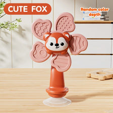 A pink cute fox shaped baby suction cup spinning toy standing on a clear base.