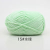 A ball of light green 15-ply milk cotton yarn for knitting and crochet.