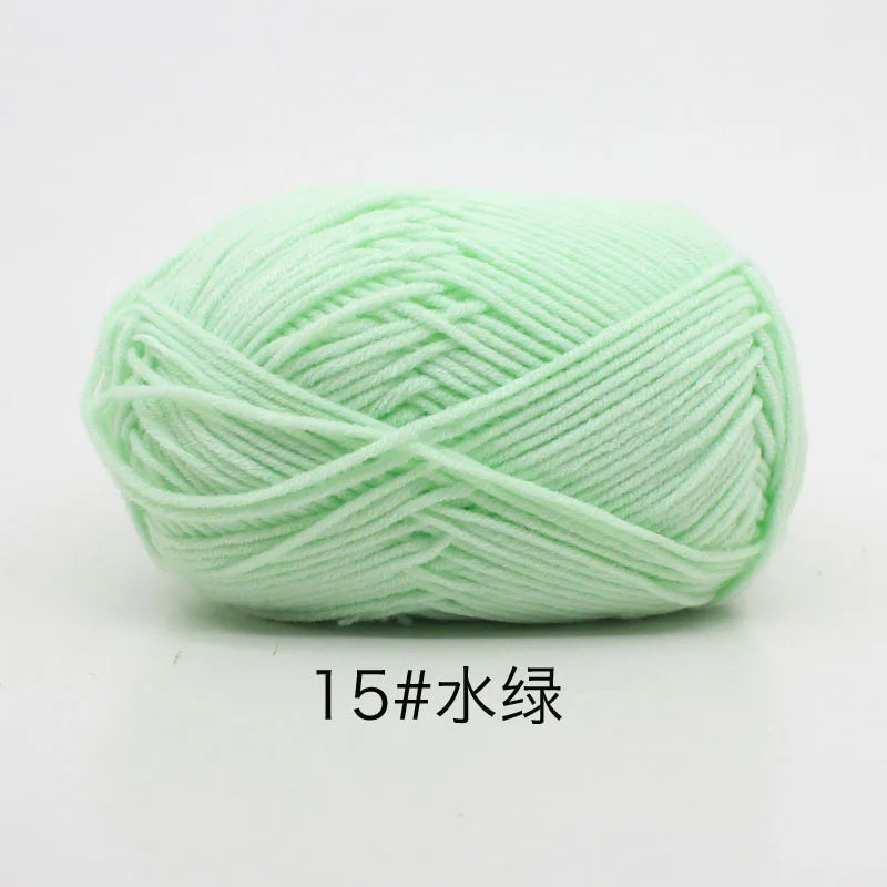 A ball of light green 15-ply milk cotton yarn for knitting and crochet.