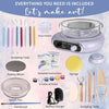 A collection of pottery tools including a wheel, brushes, spatulas, and paint palette for making art.