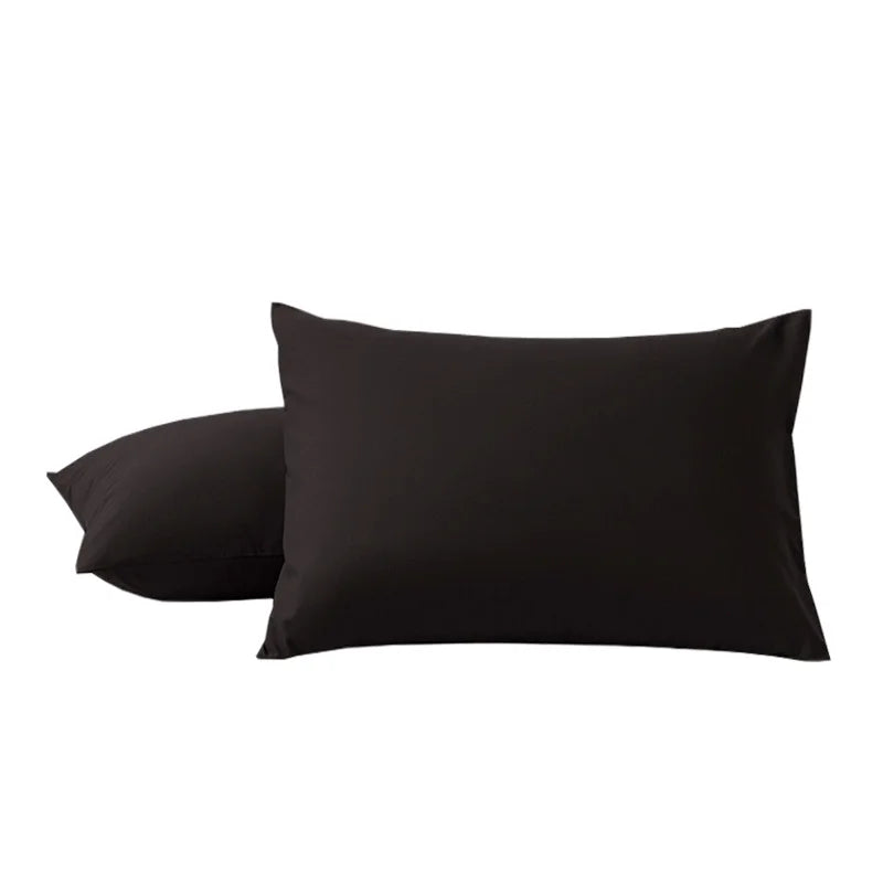 A pair of black soft microfiber pillowcases with envelope closure.