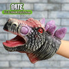A realistic dinosaur hand puppet toy with textured skin and purple fins is shown against a gray brick background.
