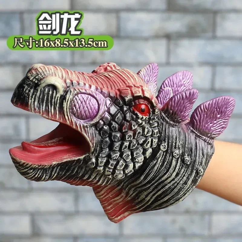 A realistic dinosaur hand puppet toy with textured skin and purple fins is shown against a gray brick background.