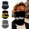 A man wearing a black neck gaiter with yellow text on his face, suitable for outdoor sports.