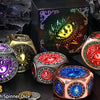 A collection of nine colorful spinner dice and a dual D20 are displayed against a dark background for Dungeons and Dragons ga