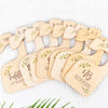 A set of wooden baby closet dividers used as size organizers for newborn to 24 months.