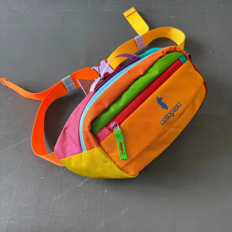An orange and yellow unisex water-resistant crossbody chest bag with adjustable straps.
