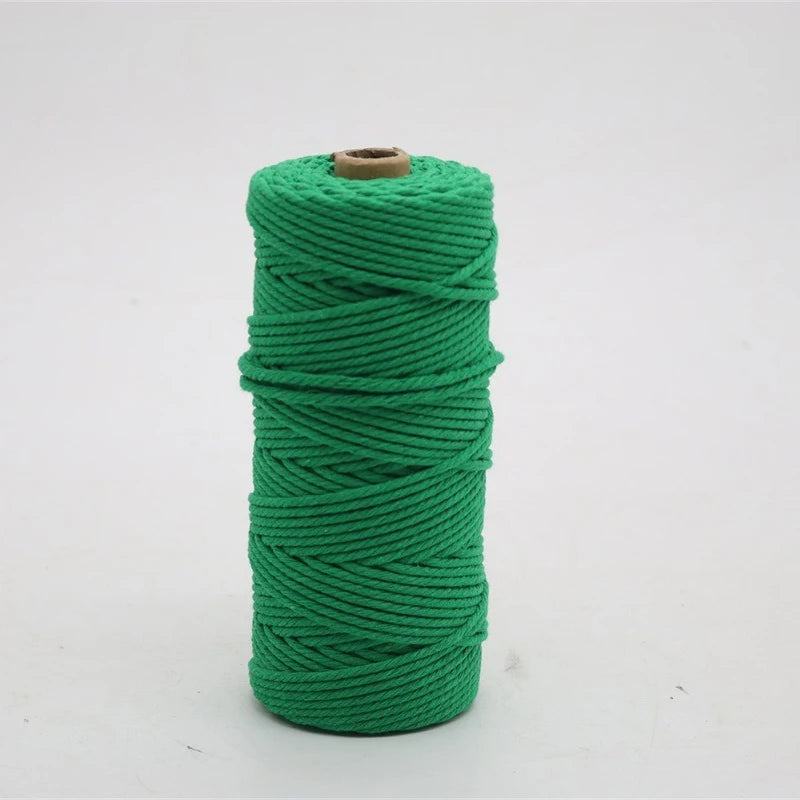 A spool of bright green macrame cord used for crafting.