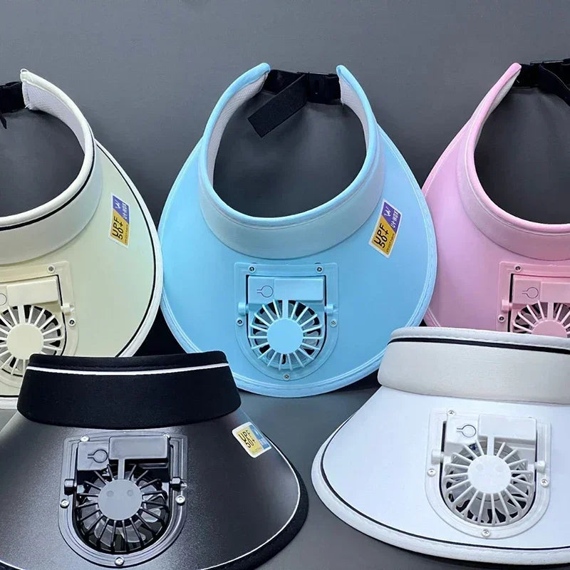 A collection of various colored USB rechargeable cooling fan hats displayed on a dark surface.
