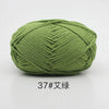 A ball of soft 4-ply milk cotton yarn in a moss green color.