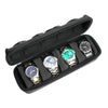 Black portable leather watch travel case with soft lining containing several wristwatches.