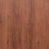 Close-up view of warm brown wood grain vinyl flooring tiles.