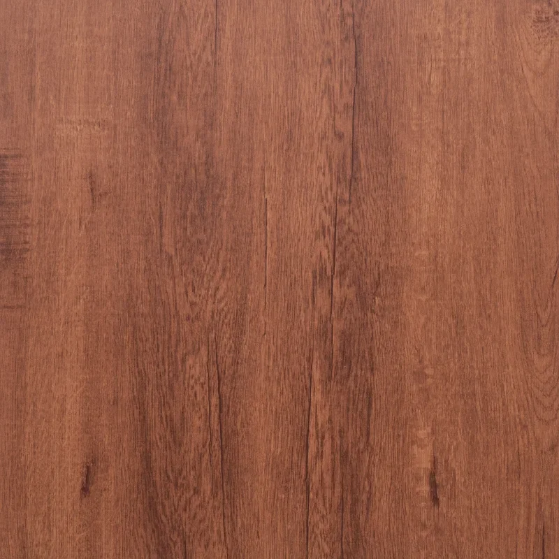 Close-up view of warm brown wood grain vinyl flooring tiles.