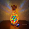 A handcrafted Turkish mosaic table lamp with a warm LED glow, featuring colorful glass pieces in an ornate vase shape.