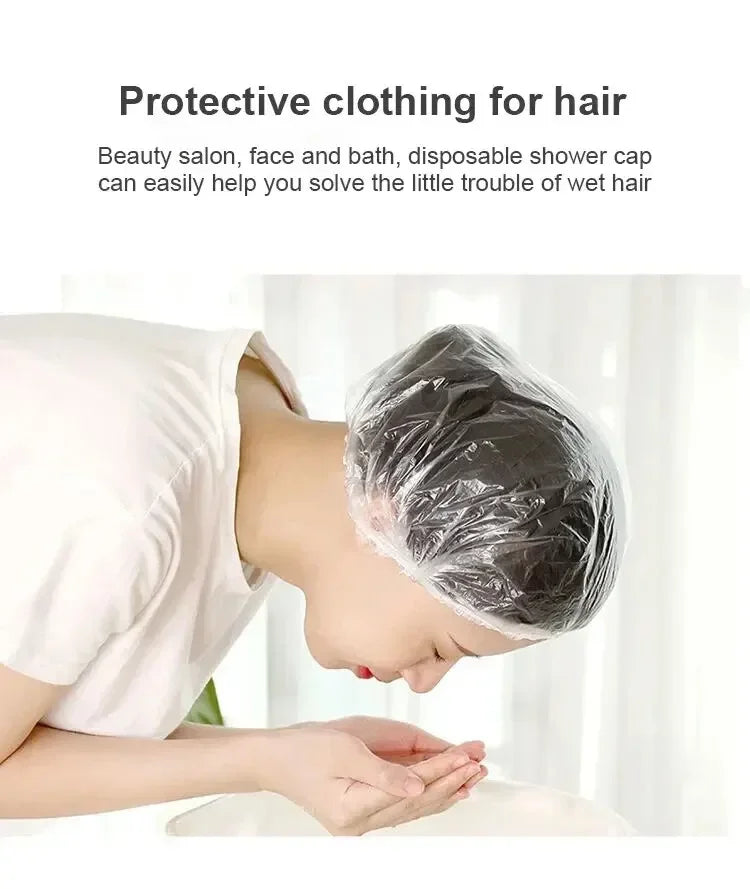 A person is using a clear disposable shower cap to cover their hair while in a bathroom setting.