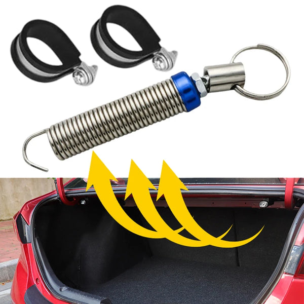 A silver spring mechanism for an automatic car trunk lift, shown with its mounting components.