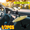 Two clip-on car crash cymbals are shown mounted on a car dashboard and interior panel.