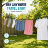 A portable clothesline with twelve clips is shown drying white and colored clothing outdoors on a sunny day.
