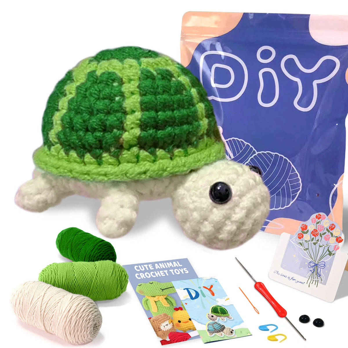 A finished green and white crocheted turtle toy next to yarn, needles, and a DIY craft bag.