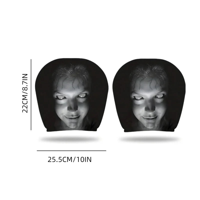 A pair of black ghost face headrest covers shown against a white background.