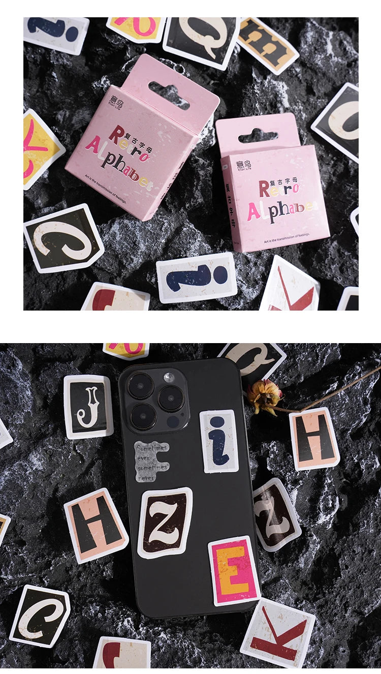 A collection of vintage alphabet stickers in various colors and shapes scattered on a dark surface.