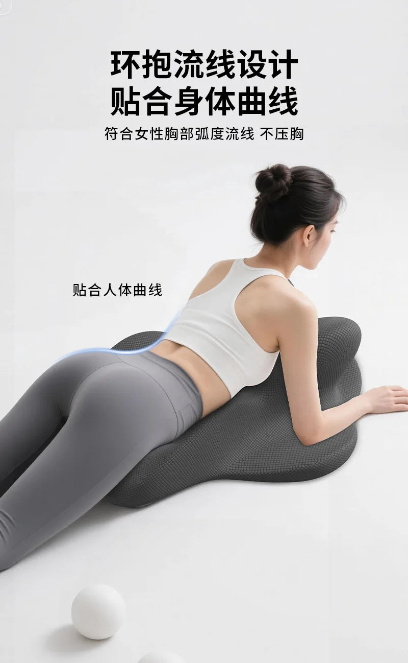 A woman is lying on a gray exercise mat, demonstrating a smooth, flexible elastic line on her body.