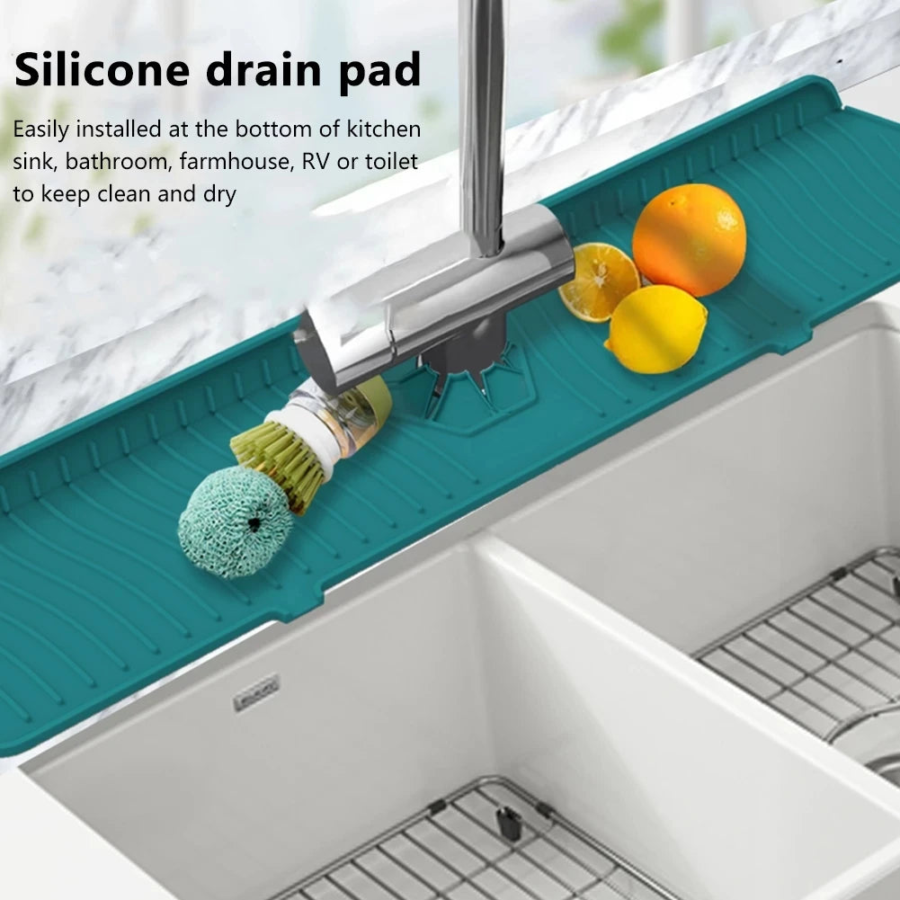 A silicone drain pad is installed at the bottom of a kitchen sink, protecting it from debris.