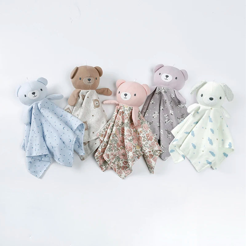 A collection of five stuffed animal baby comforters in various colors and floral patterns.