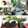 A hand holds several square pieces of green floral foam used for flower arrangements.