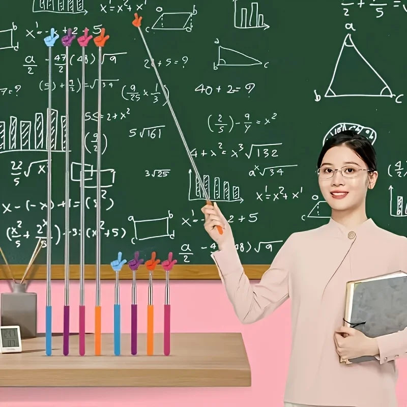 A woman points to mathematical equations written on a green chalkboard with a set of five retractable teacher pointers.