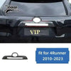 Carbon fiber trim kit for Toyota 4Runner featuring a VIP plate and headlight cover.