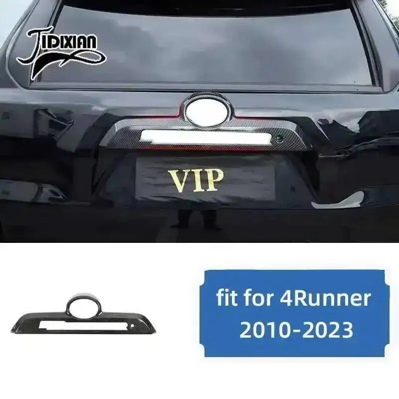Carbon fiber trim kit for Toyota 4Runner featuring a VIP plate and headlight cover.