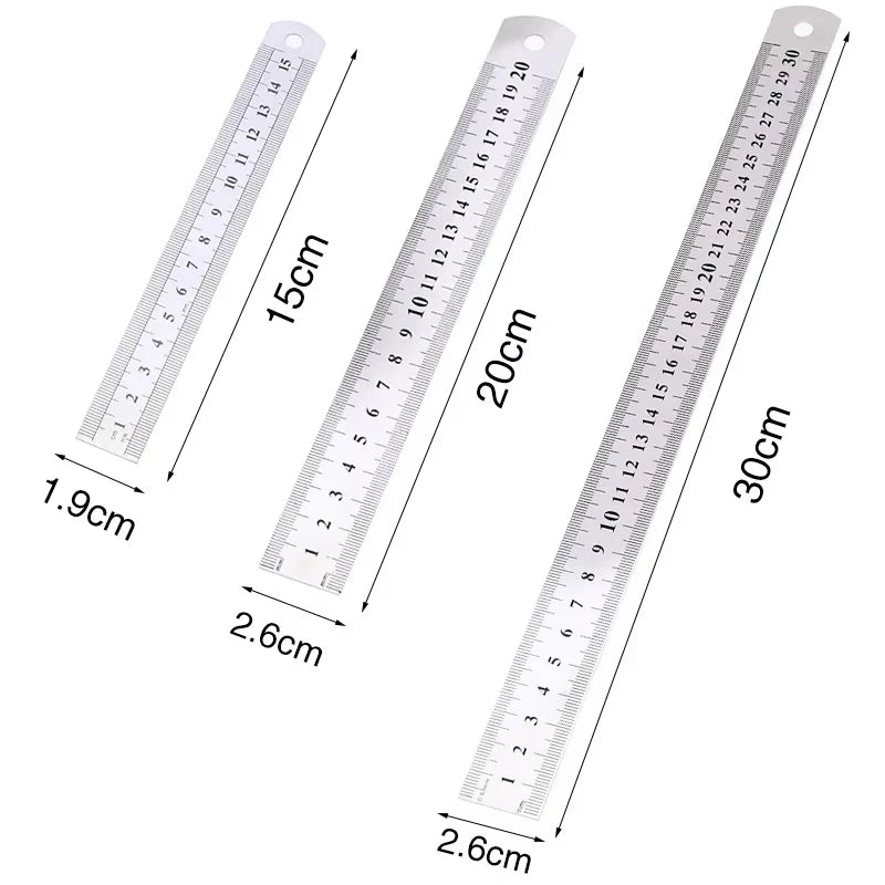 A stainless steel double-sided precision ruler showing various measurements in centimeters and inches.