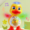 A yellow duck toy with glowing eyes and a red beak is shown dancing on a light green surface.