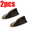Two dark brown shark fin car antennas for FM/AM signal enhancement