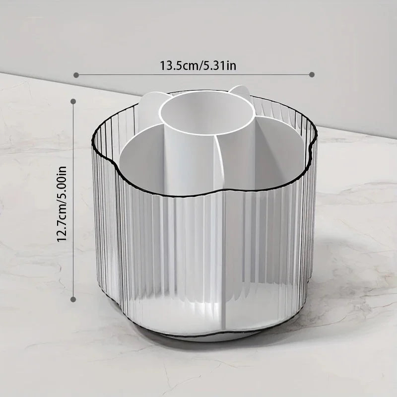 A cylindrical makeup brush holder with six compartments is shown on a marble surface.