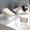 A suction cup soap holder with drainage is shown dispensing soft soap into a sink.