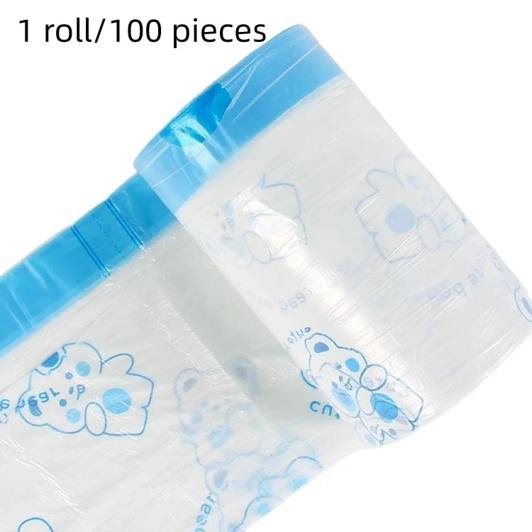 A roll of clear plastic drawstring trash bags with light blue accents and cute cloud designs.