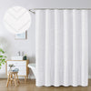 White boho waterproof shower curtain with a subtle chevron pattern hanging on a rod.